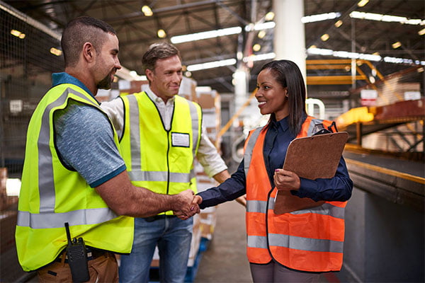 Safety professionals shake hands